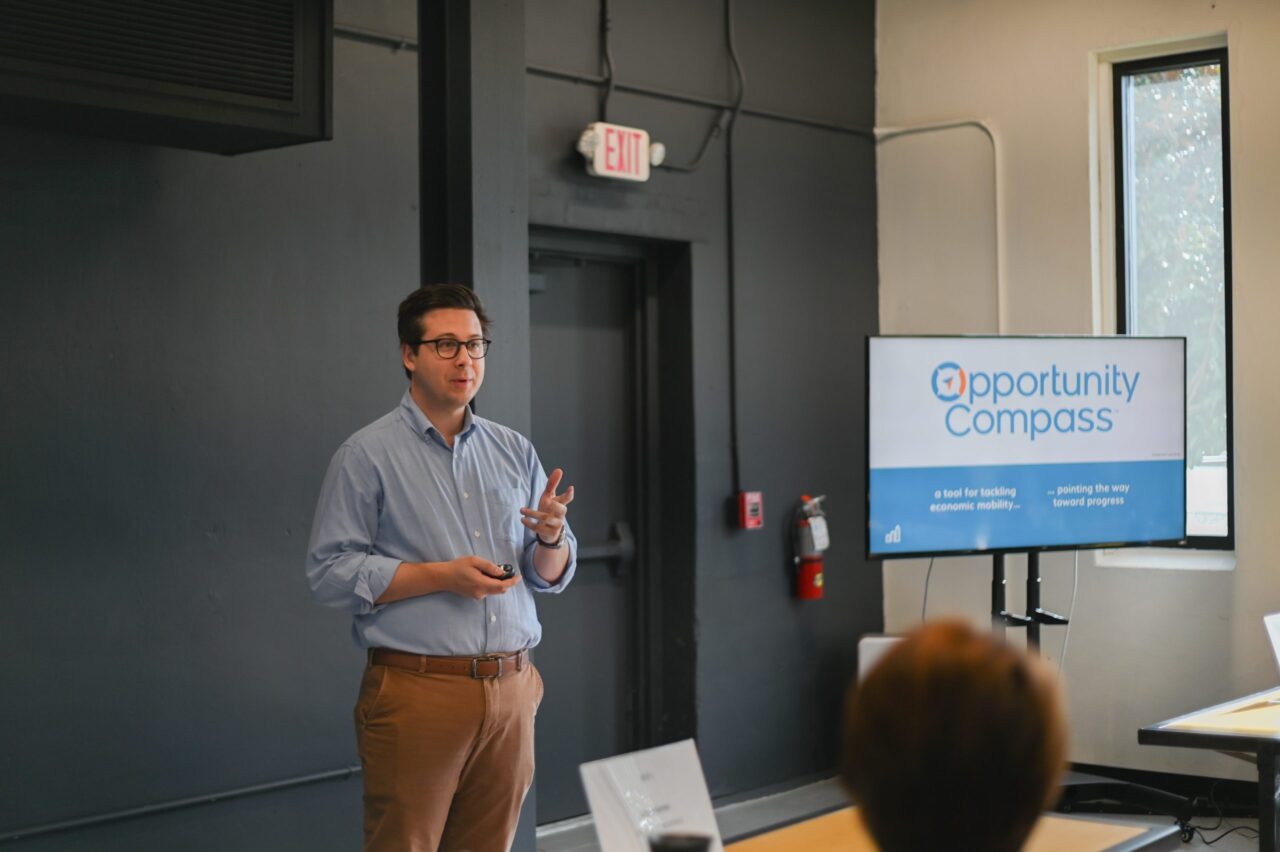 Leading on Opportunity staff presenting to audience about the Opportunity Compass